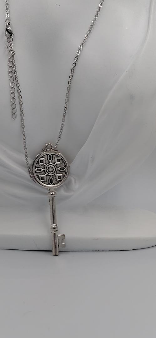 ciondollo con cammeo "la chiave del amore " incastonato in metallo