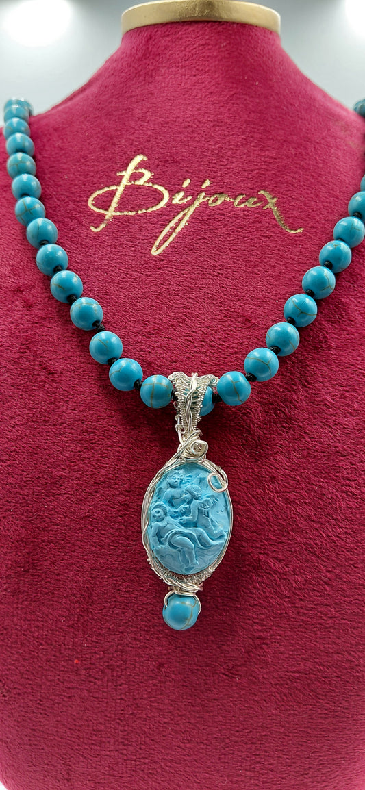 cammeo pasta di turchese " Angeli" incastonato in metallo con tecnica wire